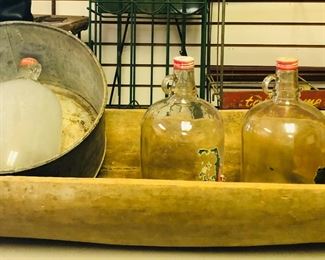 huge dough bowl(its old not a reproduction)  coke syrup bottles and galvanized feeder