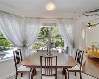 Lovely brass footed drop leaf table and 4 chairs