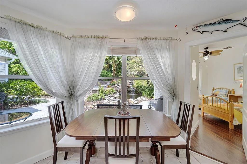 Lovely brass footed drop leaf table and 4 chairs