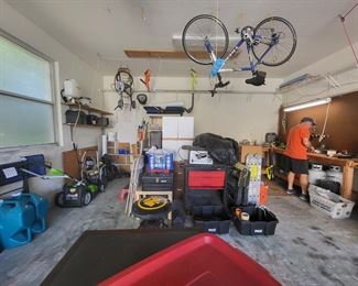 Table Saw on rolling tool chest, power painter, pressure washer, LOTS of camping gear, folding ladders, Power Painter, Back Pack sprayer, Gas Grill and tanks BAttery operated Lawn Mower and Polesaw