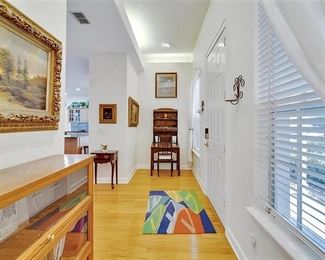 DeskLawyer's book case on left and antique desk ahead. Dinghy wool rug