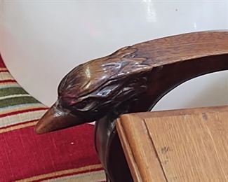 Carved bird's head on chair