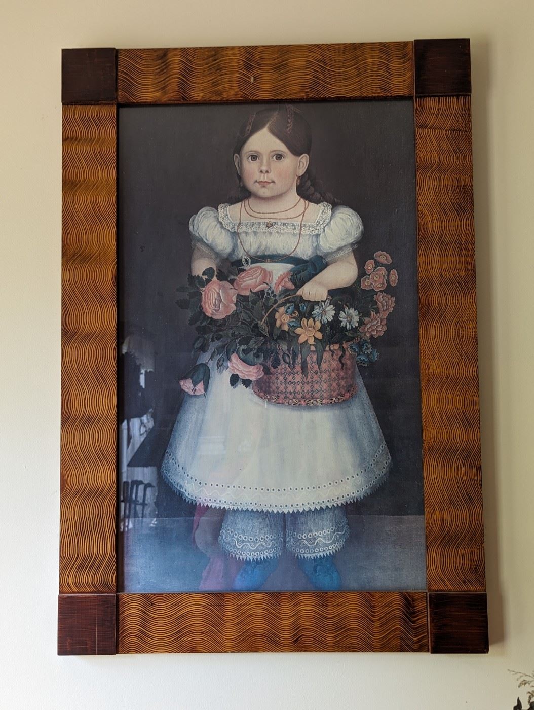 A girl with a basket of flowers in frame
