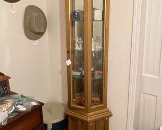 Gilt touched curio cabinet w/mirrored backing behind glass shelves   $68.00
