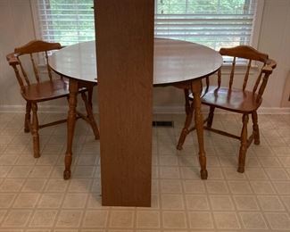 maple finish breakfast table w/leaf & 4 captains chairs   $75.00