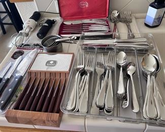 Mikasa "Bravo" stainless flatware- service for 12, plus serving utensils.