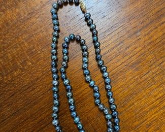 Black pearl necklace with a 14k gold clasp