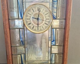 Clock with a lighthouse scene