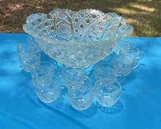 Cut glass punch bowl with twelve matching cups