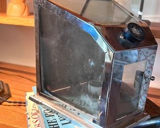 Written on the back - "Property of Indoor ADV. Co.  Cigarette/cigar lighter??