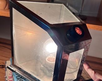 Written on the back - "Property of Indoor ADV. Co.  Cigarette/cigar lighter??