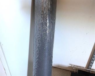 Unopened roll of window screen 