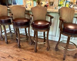 4 Custom Made Bar Stools with Leather Seats and Upholstered Backs. These are 32" H (Bar Height) to the Seat X 24" W x 24.5" D. One of them does have missing screw for one of the arms.