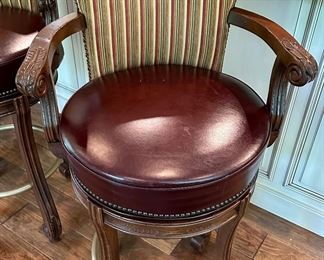 4 Custom Made Bar Stools with Leather Seats and Upholstered Backs. These are 32" H (Bar Height) to the Seat X 24" W x 24.5" D. One of them does have missing screw for one of the arms.