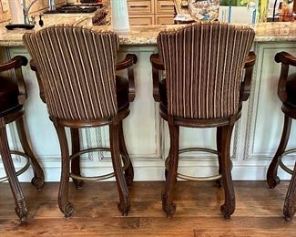 4 Custom Made Bar Stools with Leather Seats and Upholstered Backs. These are 32" H (Bar Height) to the Seat X 24" W x 24.5" D. One of them does have missing screw for one of the arms.