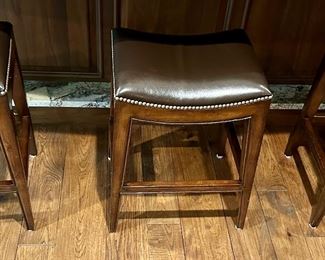 3 very nice Leather Bar Stools from Woodbridge Furniture with Nailhead Detail around the Seat. 24" H for a Counter. Very nicely made.