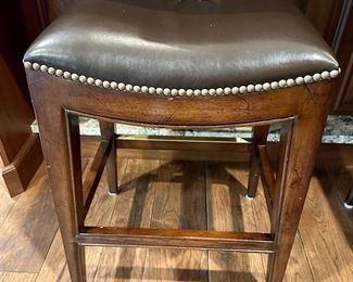 3 very nice Leather Bar Stools from Woodbridge Furniture with Nailhead Detail around the Seat. 24" H for a Counter. Very nicely made.