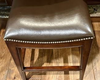 3 very nice Leather Bar Stools from Woodbridge Furniture with Nailhead Detail around the Seat. 24" H for a Counter. Very nicely made.