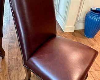 Custom Table made by Design Master. Table expands fro 54" Round to 70" Round plus total of 6 Custom Made Leather Chairs with Nail Head Trim. Looks like Brand New.