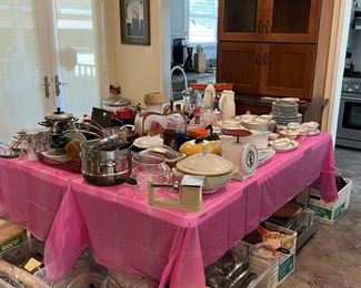 More of the kitchen pieces. I see a scale, a few pots and pans, a ceramic serving dish, lids, and so much more.