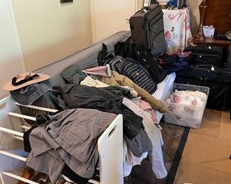 You can see the shoe rack here in front of the sofa full of clothes.