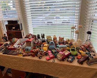 The collection of model and toy cars. The Batmobile (from the 1960's TV show) is off to the right. A classic Snoopy toy is more on the left. The far left has a couple of classic radios. Do they work? Come find out!