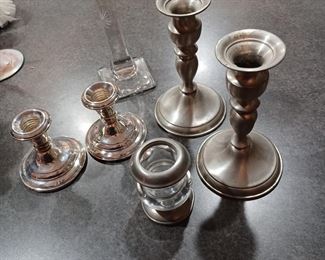 Many pewter candlesticks and items 