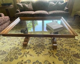 Glass, wood and iron coffee table. 54"L x 36"W x 21"H