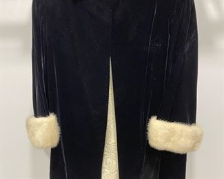 Vintage 1960s black velvet coat with white fur cuffs