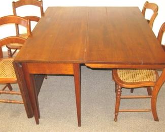 Antique cherry drop leaf table with tapered legs   