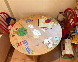 child's wooden table with old painted chairs