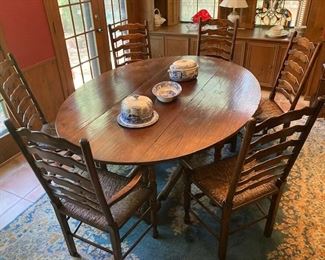 Large drop leaf table with six ladderback chairs