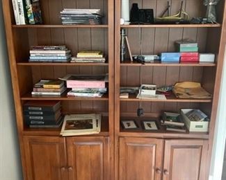 Two wood cabinet/shelving units