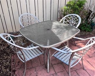 Glass top patio table and 4 chairs
