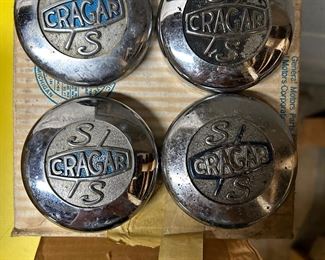 Four Crager hubcaps 