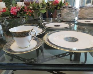 Gold Plated China - Royal Doulton. Purchased at Riches Dept. Store. 12 place setting with salt and pepper shaker (2 sets); sugar and creamer; 2 serving plates; 2 vegetable bowls.