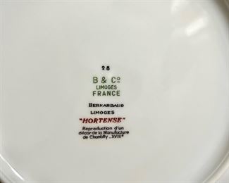 Set of 12 Limoges “Hortense” blue and white dinner plates and luncheon plates.
