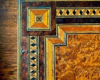 Close-up of inlaid antique French Napoleon lll table with box