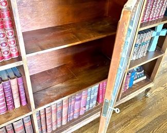 Antique bookcase with cupboard - cupboard door has inlaid map of 1600s USA