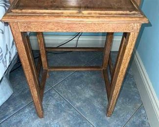 2 nesting tables with ornate tops