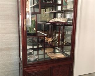 Asian style rosewood curio or display cabinet with tiered shelves