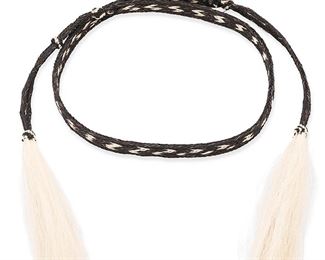 1019
20th century
A Braided Horsehair Belt/Hatband
Braided in dark brown and blonde horse hair, terminating in tassels
63" L x 0.75" W
Estimate: $100 - $200