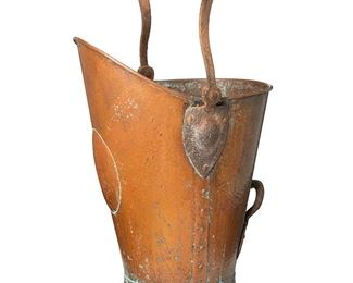 1039
Circa 1905
A Gustav Stickley Hammered Copper Coal Scuttle
The copper plated brass bucket with biomorphic handle and riveted seams, terminating in a fluted foot
26.5" H x 12.25" W x 14.25" D
Estimate: $1,000 - $1,500