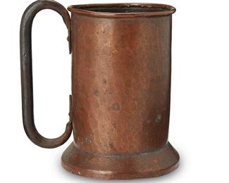 1040
Early 20th century
A Stickley Brothers Hammered Copper Tankard No. 45
Stamped to the underside: 45
The handled metal mug with sturdy foot and rolled lip
6.75" H x 4.5" Dia.
Estimate: $300 - $500