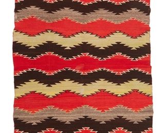 1047
Mid-20th century; Diné
A Navajo Transitional Blanket
Woven in red, green, dark and light brown, and cream wool in a serrated banded motif
44" H x 74" W
Estimate: $3,000 - $5,000