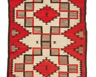 1056
Mid-20th century; Diné
A Navajo Regional Rug
Woven in red, brown, cream and natural grey brown wool with central stepped and serrated diamonds
87.5" H x 63.5" W
Estimate: $600 - $800