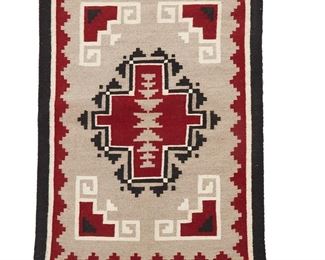 1060
Late 20th century; Diné
A Navajo Ganado/Klagetoh Textile
Woven in red, grey, black, and cream wool with a central cross within a stepped diamond and a stepped border
35" H x 24" W
Estimate: $200 - $300
