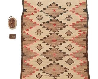 1080
Early/mid-20th century
A Group Of Three Native American Items
Three works:
A Navajo/Diné regional rug
Woven in cream, red, brown and dark grey wool with three columns of five diamonds with half-columns to the sides
50" H x 36" W
A small Inuit carved wood mask with fur and painted features
6.5" H x 4" W x 2.5" D
A small Southwest-style copper box
With stampwork to the lid and an applied bronzed metal Thunderbird motif
1.375" H x 3.25" W x 2.375" D
3 pieces
Estimate: $600 - $800