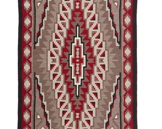 1082
Robert Toney (B. 20th Century, Diné)
A Navajo Ganado Klagatoh textile, circa 2009
Woven in light and dark grey, red, cream, and black wool with a central stepped diamond motif and floating stepped motif border
50" H x 34" W
Estimate: $400 - $600