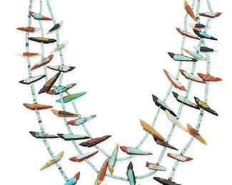1086
Mid/late 20th century
A Pueblo Turquoise Carved Stone Fetish And Shell Necklace
A triple-strand necklace of turquoise and shell beads with carved stone and inlay birds in various stones and colors, with a silver clasp
29.5" L (inner strand)
Estimate: $300 - $500